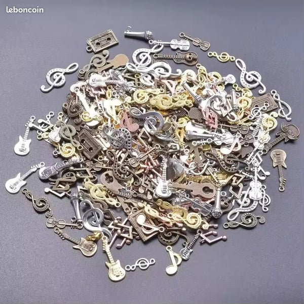 Lot 50 breloques creation bijoux theme musique en metal neuf