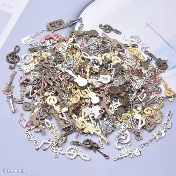 Lot 50 breloques creation bijoux theme musique en metal neuf