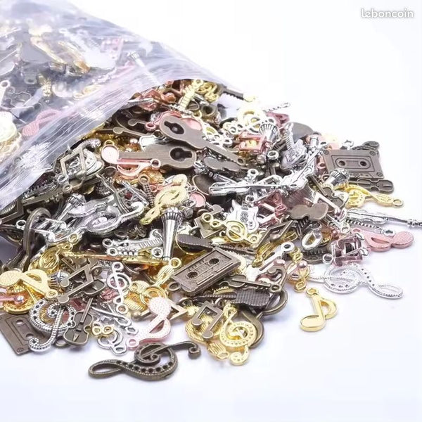 Lot 50 breloques creation bijoux theme musique en metal neuf